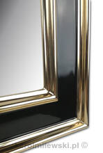 Mirror in black frame gilded with genuine 22ct gold leaf