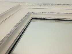 Mirror in white frame