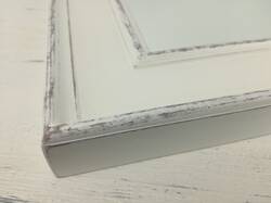 Mirror in white frame