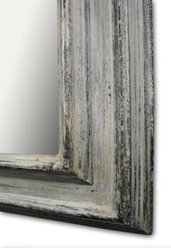 Bottom corner of the frame showing wood grain and aged silver finish