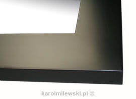 Mirror in black frame.