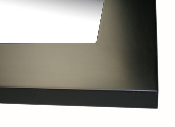 Mirror in black frame.