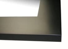 Mirror in black frame.