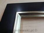 Mirror in black frame, partially gilded white gold leaf