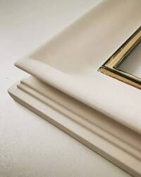 White matt picture frame with gilded lip.