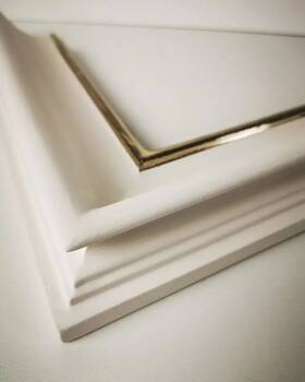 White matt picture frame with gilded lip.