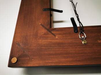 Practical clips for easy mounting of artwork in gilded frame