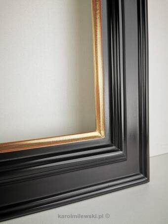 Close-up of handcrafted gilded frame with 22K gold leaf and red bole clay.