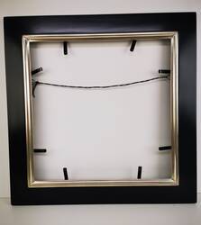 Black picture frame, partially gilded white gold leaf over red bole.