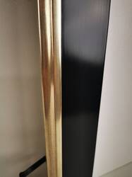 Black picture frame, partially gilded white gold leaf over red bole.