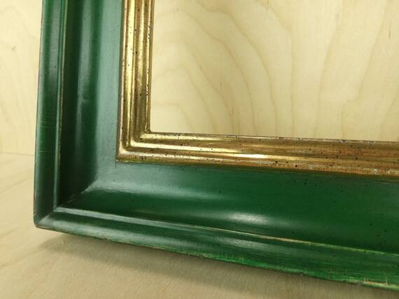Mirror in green frame gilded gold leaf