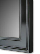 Mirror in black frame.