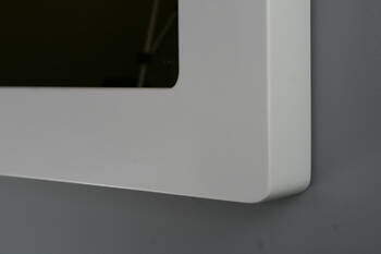 Detail of the bottom corner of the white frame with a soft curve and uniform colour on the front and side