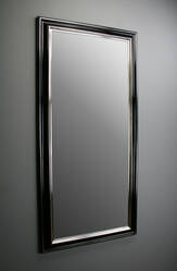 Mirror in black frame gilded with white gold leaf