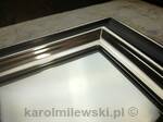Mirror in black frame gilded with white gold leaf