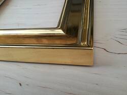 Mirror in gold frame gilded sides.