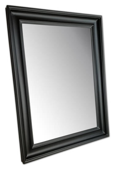 Mirror in a black frame in semi-matt finish — angled view of the full solid wood surround