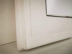 White matt picture frame with gilded 22ct gold leaf over gray bole, lip. 