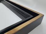 Picture frame gilded with yellow gold with smooth black sides