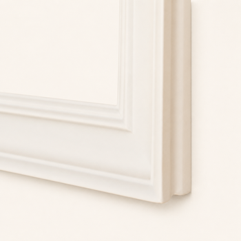 White picture frame — three-quarter corner view showing the gentle half-round cove on the outer side wall and the rabbet recess