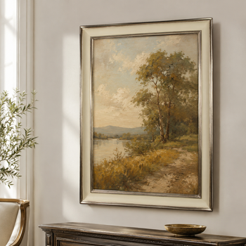 Cream and gold made-to-measure picture frame for an oil landscape painting, hand-gilded with moon gold, on the wall of a bright, classic interior