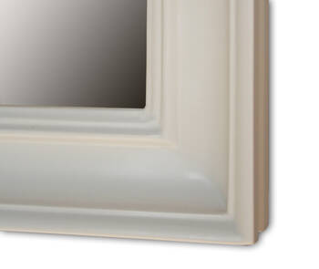 Close-up of the off-white frame corner — multi-stepped moulding profile with subtle grooves running parallel to the edge and softly rounded transitions between levels